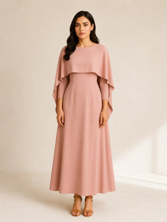 Amina Cape Maxi in blush pink by WAROODI with flowing cape overlay, front view