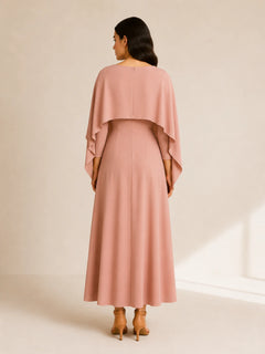 Back view of WAROODI Amina Cape Maxi in blush pink with flowing cape overlay