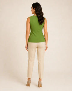 Back view of WAROODI Aria Knot Top in olive green styled with cream tailored trousers