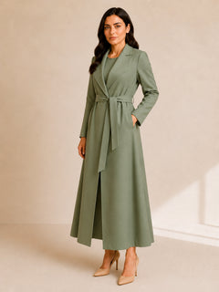 Aria Prestige Belted Coat by WAROODI three-quarter view, showing the structured double-layered front, tailored lapel collar, belted waist, and elegant modest outerwear design.
