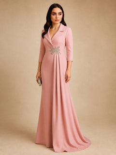 Celestia Draped Evening Gown by WAROODI three-quarter view, showing the structured lapel neckline, crystal-embellished waist brooch, soft side drape, smooth satin-crepe texture, and refined modest styling.