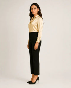 WAROODI Celina Satin Cowl Shirt in champagne with soft drape and black trousers, side view
