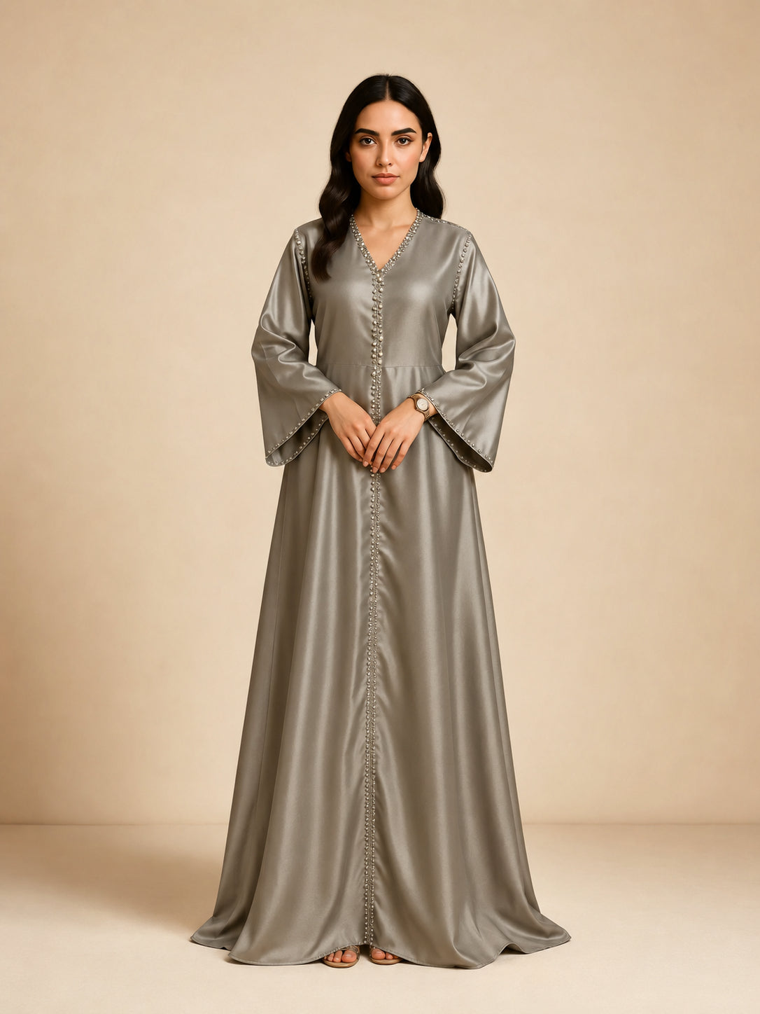 Layali Satin Embellished Kaftan by WAROODI front view, silver grey full-length modest kaftan with V-neckline, crystal-trim detailing, embellished front panel, and flowing satin silhouette.