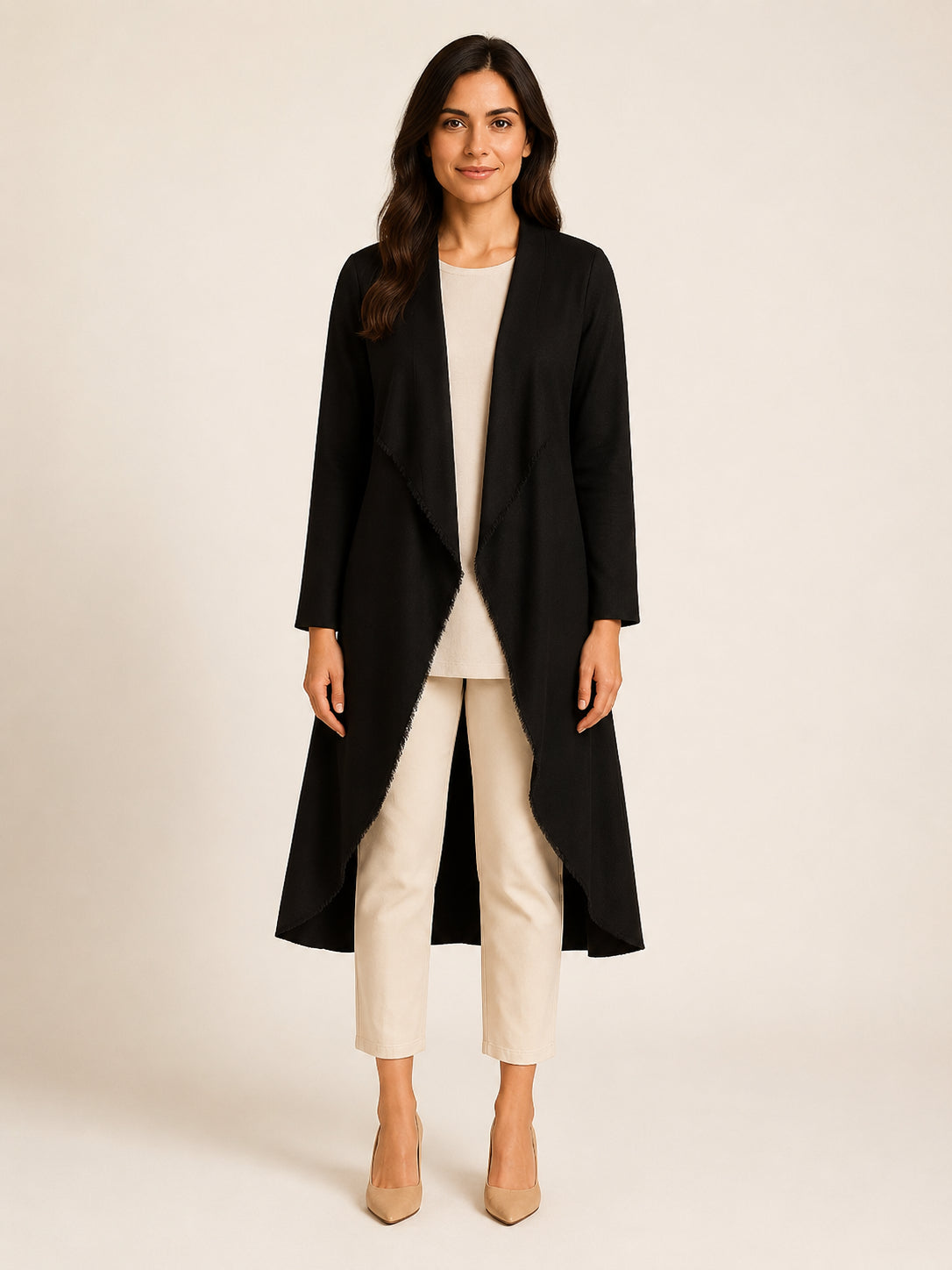 WAROODI Liana Flow Coat in midnight black layered over ivory top and trousers, front view