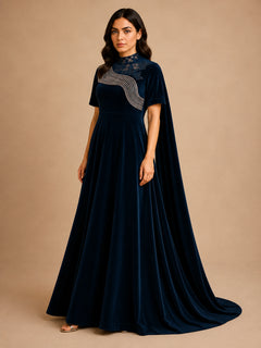 Prestige Midnight Blue Velvet Gown by WAROODI three-quarter view, showing the rich velvet texture, soft A-line silhouette, embroidered chest detail, and elegant modest luxury design.