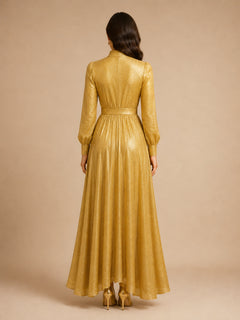 Golden Aura Shimmer Gown by WAROODI back view, full-length modest gown with smooth flowing shimmer fabric, elegant high-neck structure, soft movement, and polished occasionwear finish.