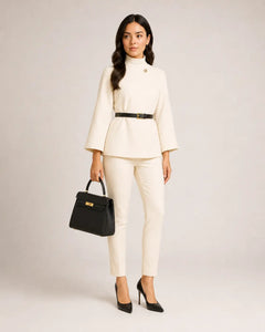 Ivory cream modest cape co-ord set by WAROODI with black belt and slim tailored trousers, three-quarter view