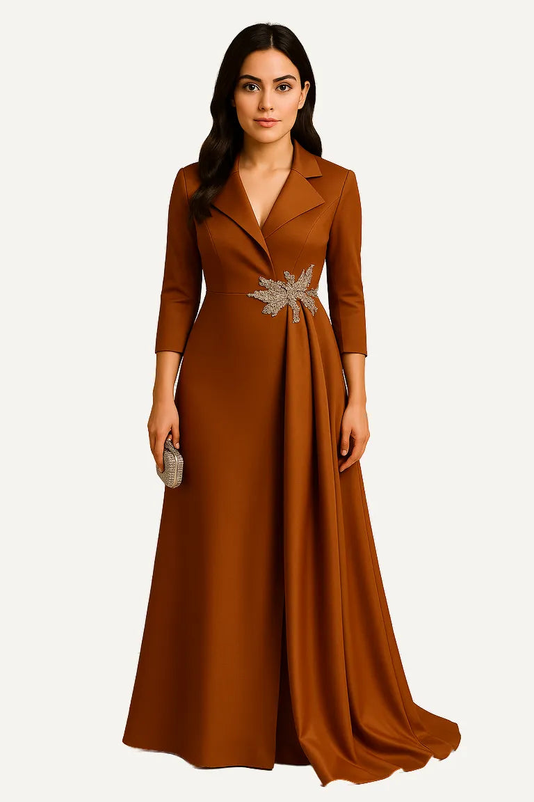 WAROODI Celestia Draped Gown in Caramel Gold – structured draped gown with crystal waist embellishment and lapel neckline